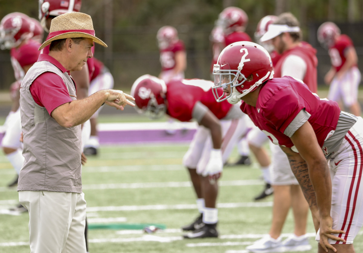 Nick Saban coaches Patrick Surtain II during a Citrus Bowl practice